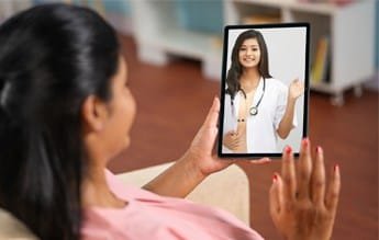 Doctor consulting with a patient about Pregnancy Care virtually